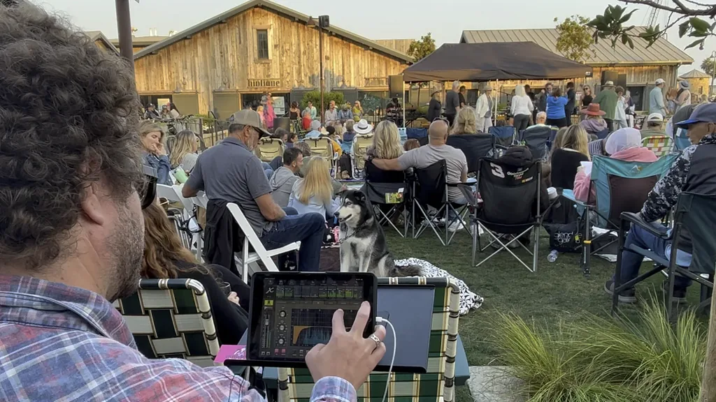 Dakota Lee Martinez mixing an outdoor show from an iPad at Vintage