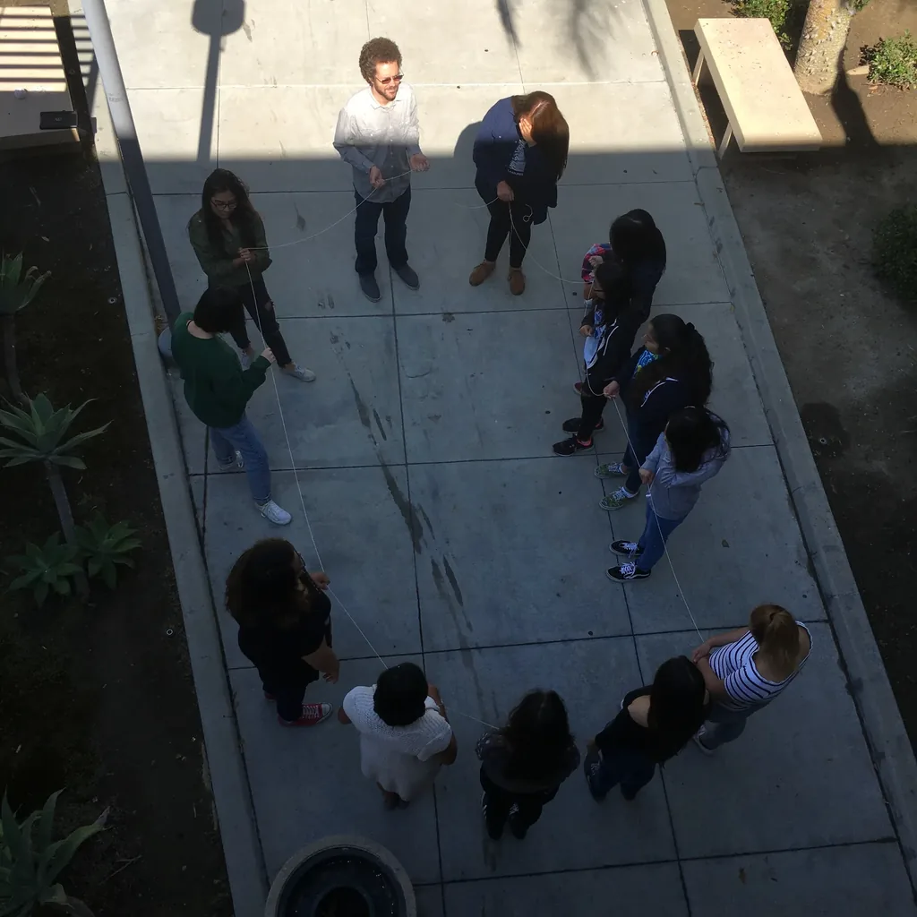 Dakota Lee Martinez teaching a group of students outdoors
